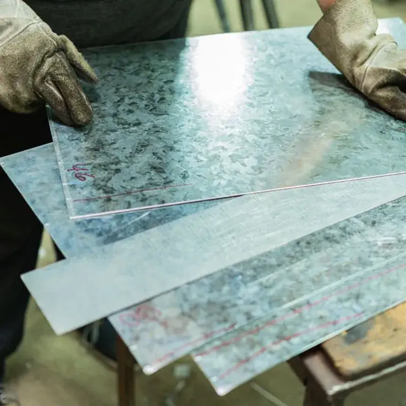 Pre-weld laser ablation removing zinc from galvanized electrical cabinet joint)