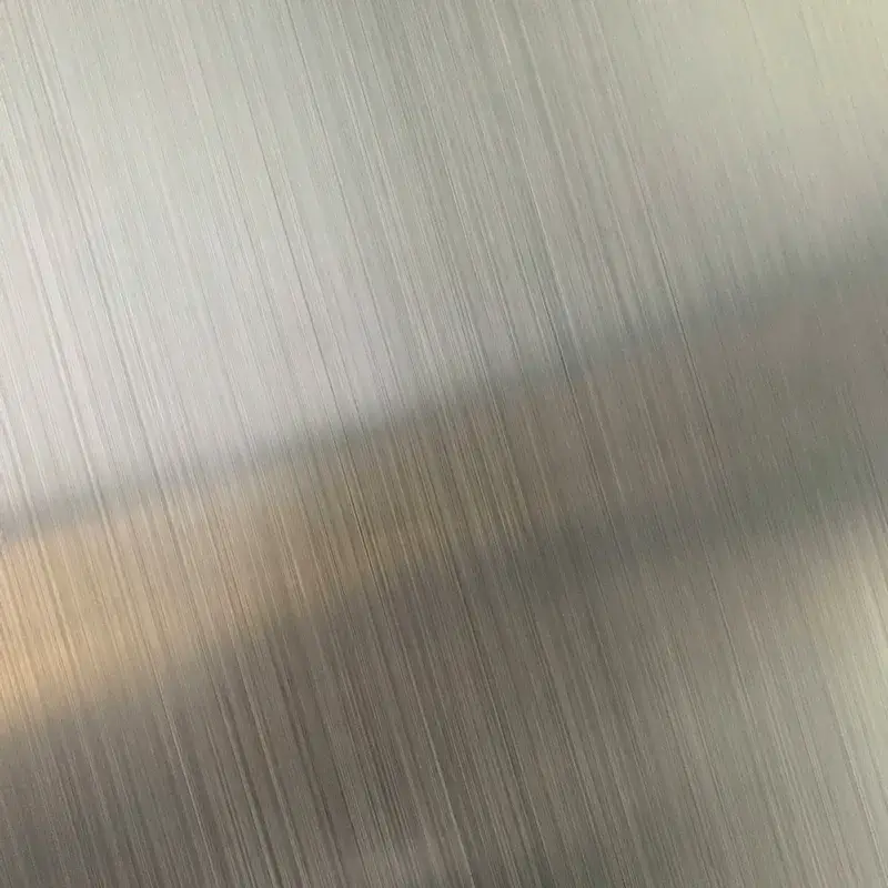 Pre-weld laser cleaning removing protective film residue and glue from elevator stainless steel