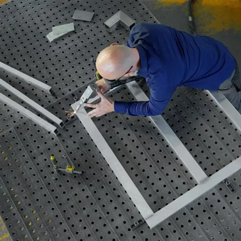 High-speed laser welding of stiffener ribs on the back of an elevator door panel