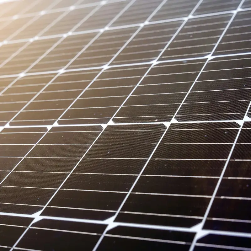 Photovoltaic solar panels undergoing the rigorous Double 85 damp-heat test in an environmental chamber.