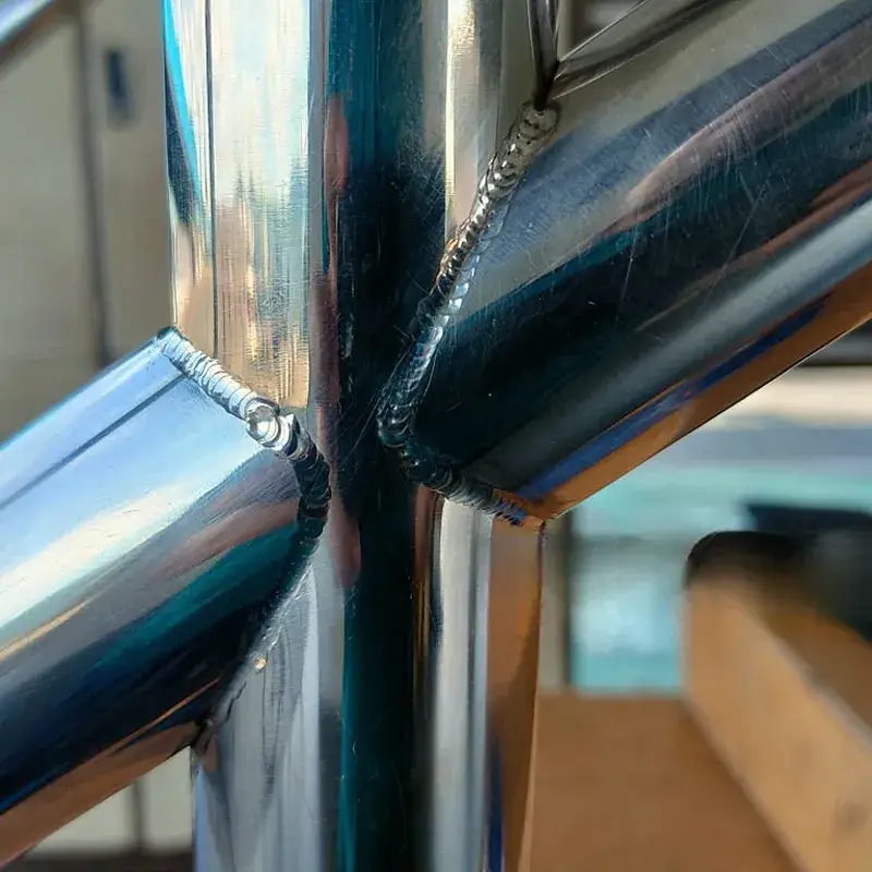 Post-weld laser cleaning removing heat tint and oxidation for an aesthetic finish.