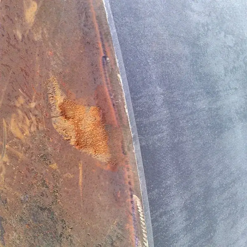 Pre-weld laser ablation removing rust from sheet metal substrate