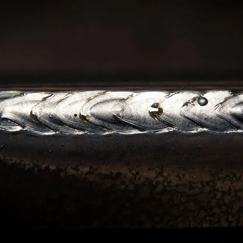 High-speed continuous laser welding on thin stainless steel sheet with zero distortion.